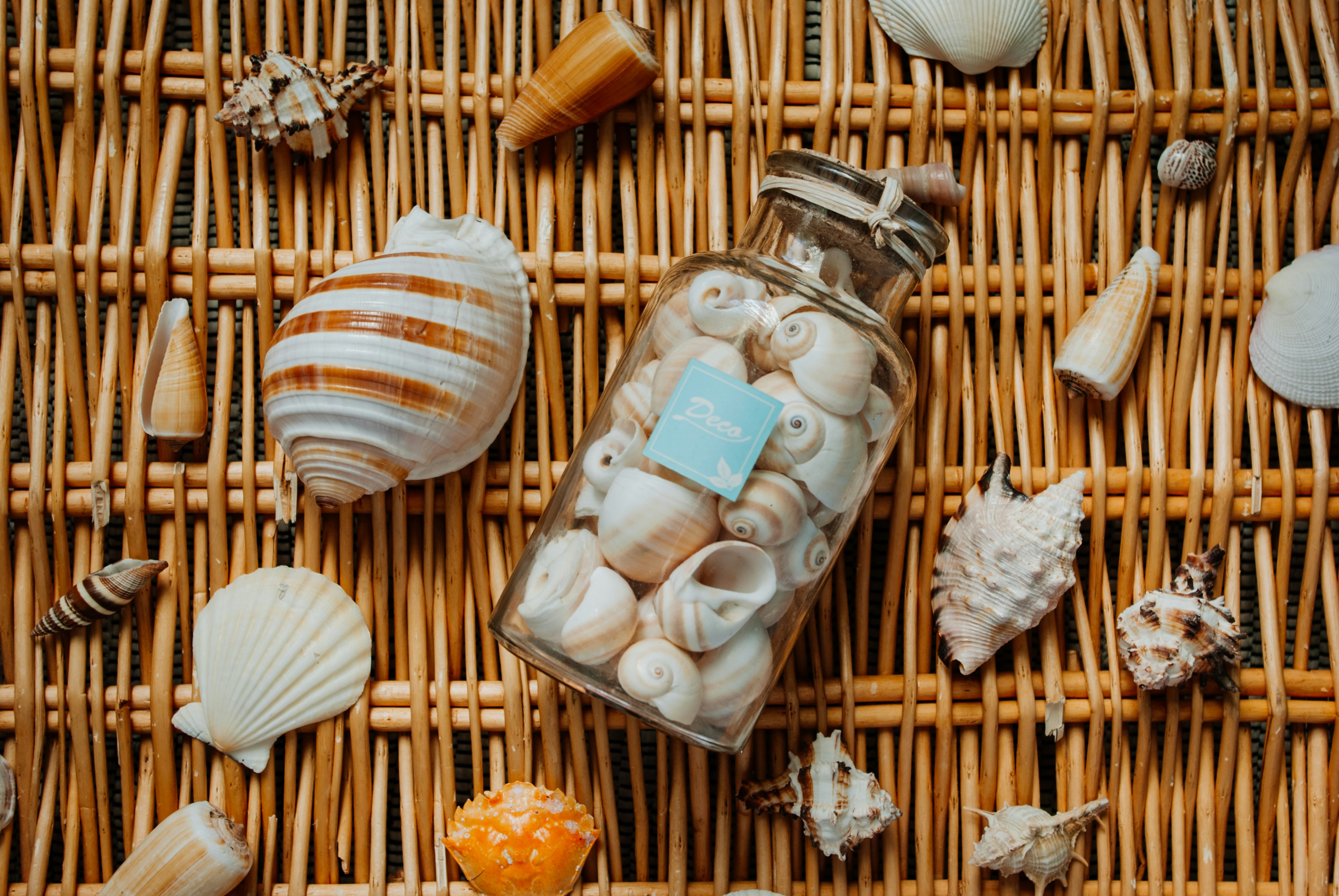 clear glass jars on brown woven basket